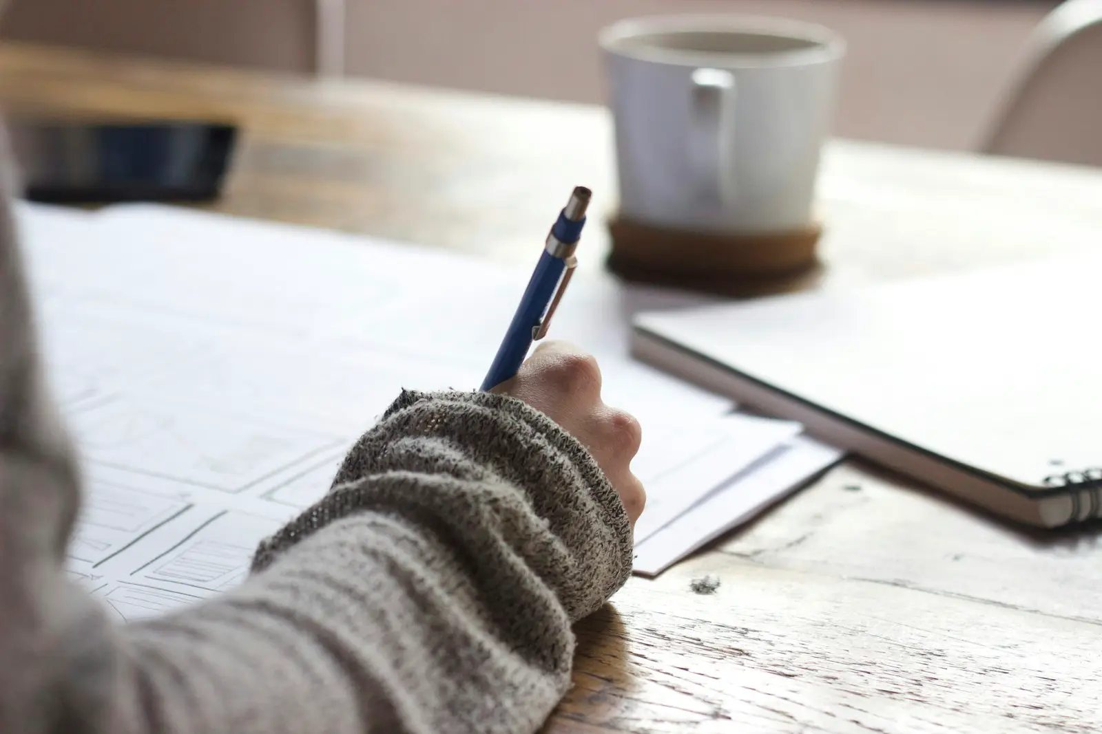 Planning desk stock photograph for the about page of PAS 128 Surveyors UK
